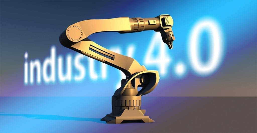 L’innovazione dell’industria 4.0 e la saldatura robotizzata: come si innova oggi. L'immagine ritrae un braccio robotico in primo piano con, sullo sfondo, la scritta industry 4.0